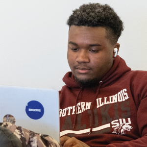 A student using their laptop at Morris Library