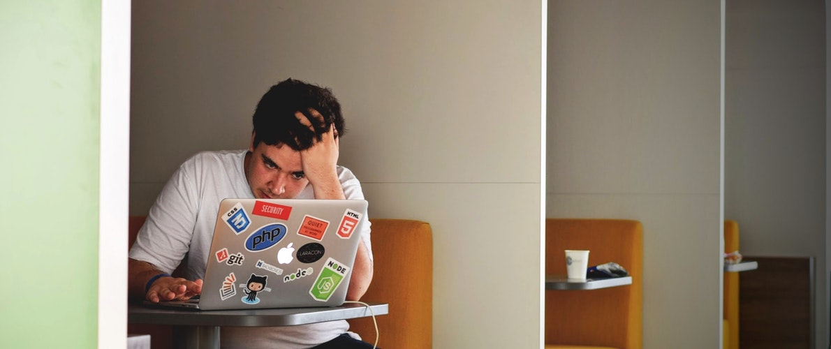 frustrated man using laptop